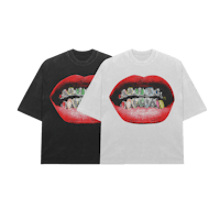 two t - shirts with teeth on them